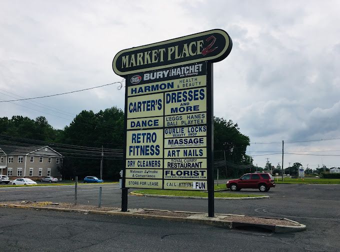 Marketplace sign for Paradise Massage in Matawan