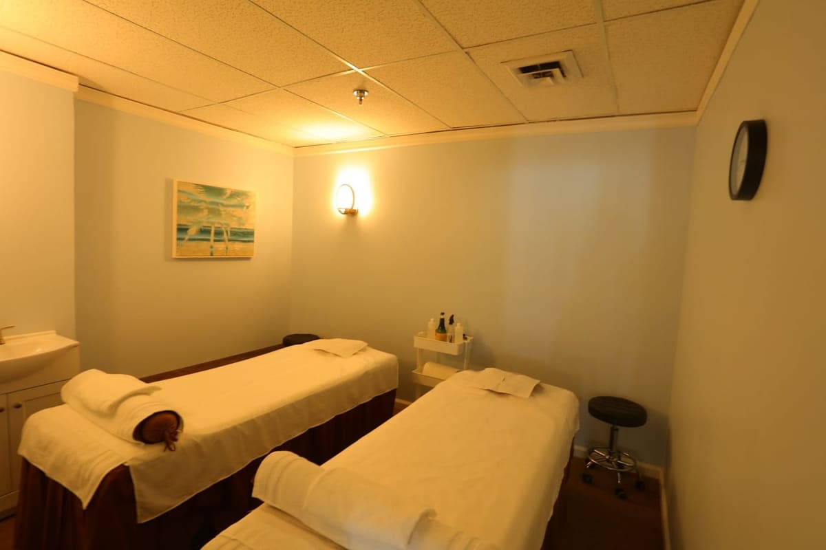 A warm, softly lit treatment room at Paradise Massage in Matawan, NJ